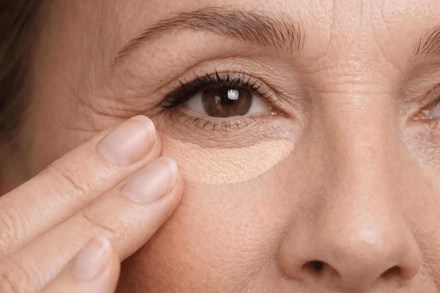 Ring finger pressing technique for concealer application on mature under-eye